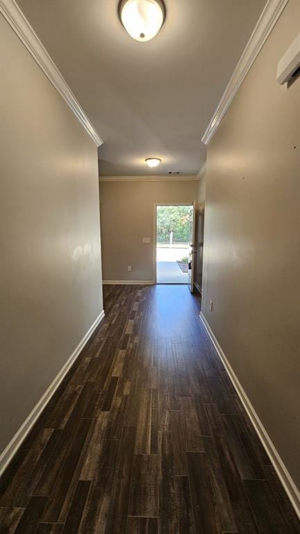 corridor featuring ornamental molding and dark hardwood / wood-style floors