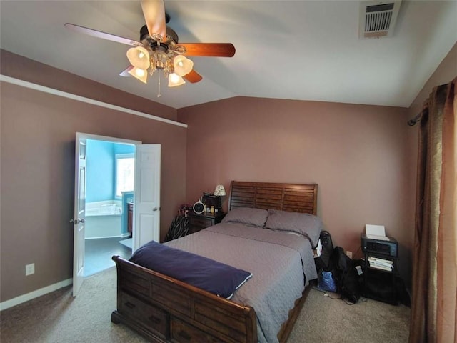 bedroom with visible vents, baseboards, connected bathroom, carpet, and vaulted ceiling