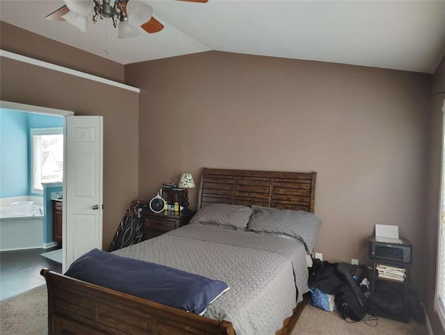 bedroom featuring carpet flooring, a ceiling fan, and lofted ceiling