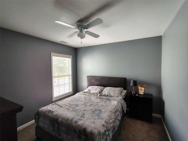 carpeted bedroom with baseboards, ceiling fan, and visible vents