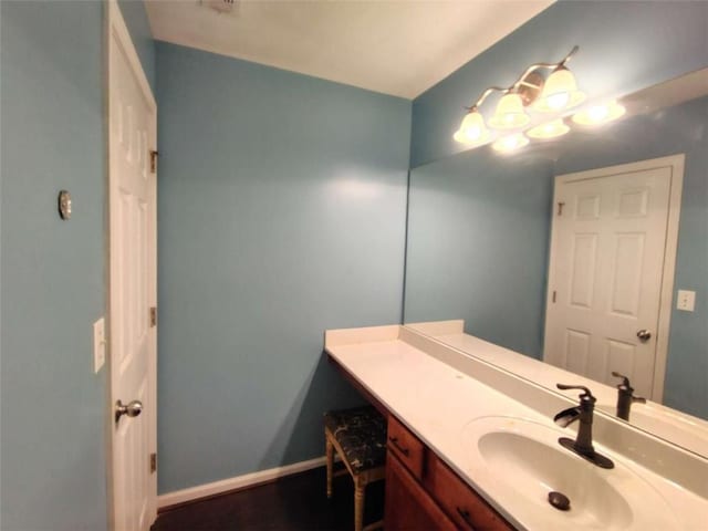 bathroom featuring vanity and baseboards