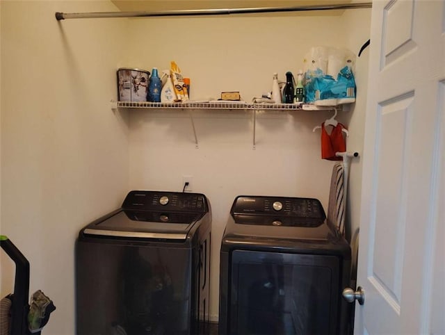 washroom with laundry area and washing machine and dryer