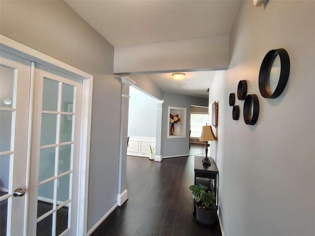 hall featuring baseboards and dark wood-style floors