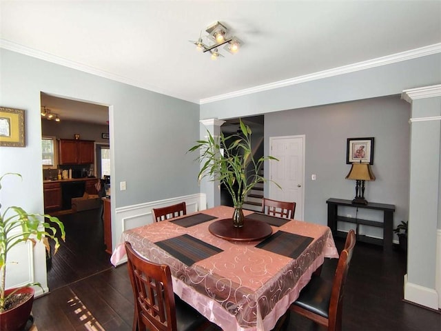 dining room featuring ornamental molding and dark wood-style flooring