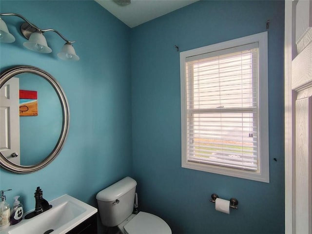 half bathroom featuring a sink and toilet