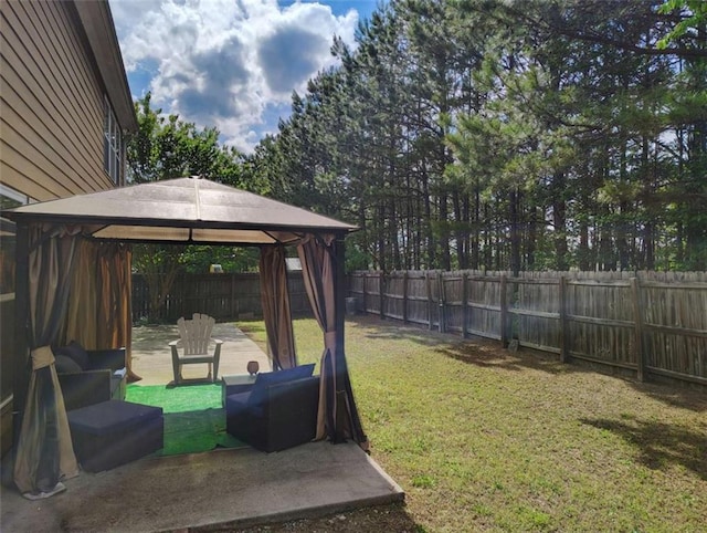 view of yard with a gazebo, a fenced backyard, and a patio area