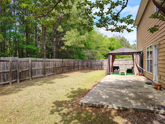 view of yard featuring a gazebo, a fenced backyard, and a patio area
