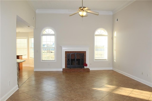 unfurnished living room featuring ceiling fan, light tile patterned floors, crown molding, and a brick fireplace