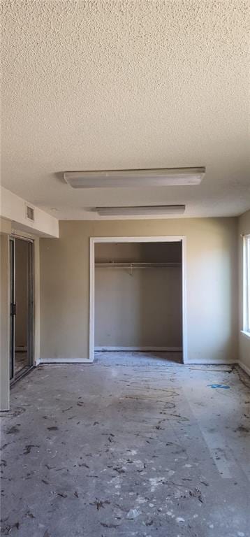 interior space featuring a textured ceiling