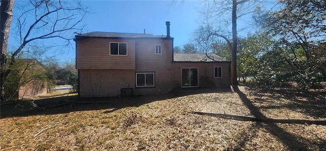 back of property featuring central air condition unit