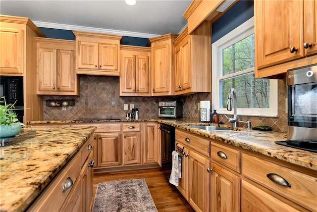 kitchen featuring crown molding, black appliances, light stone counters, a sink, and dark wood-style floors