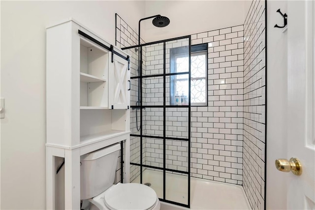full bathroom featuring toilet and a stall shower