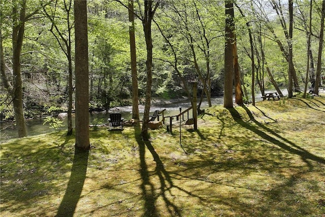 exterior space with a wooded view