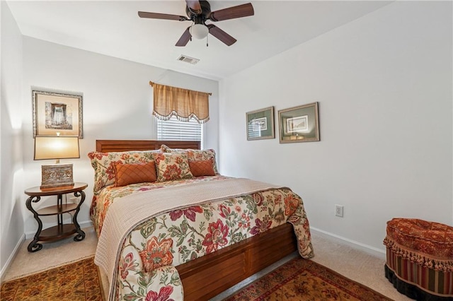 bedroom featuring ceiling fan and dark colored carpet