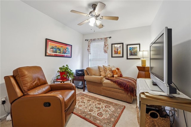 sitting room with light colored carpet and ceiling fan