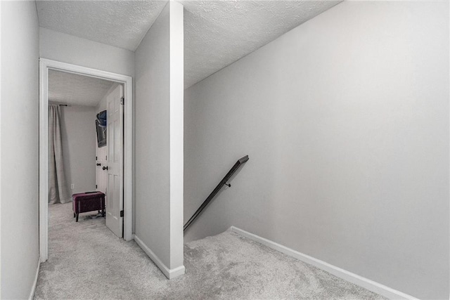 115 Winding River Dr Unit B, Atlanta, GA 30350 - stairway featuring carpet floors and a textured ceiling
