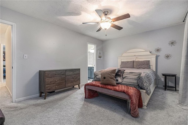 115 Winding River Dr Unit B, Atlanta, GA 30350 - carpeted bedroom featuring a ceiling fan, connected bathroom, and a textured ceiling