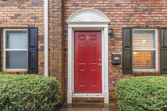 115 Winding River Dr Unit B, Atlanta, GA 30350 - doorway to property with brick siding