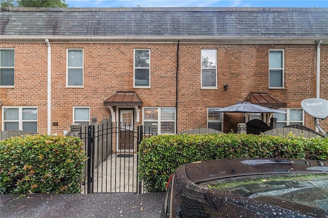 115 Winding River Dr Unit B, Atlanta, GA 30350 - townhome / multi-family property with roof with shingles and brick siding