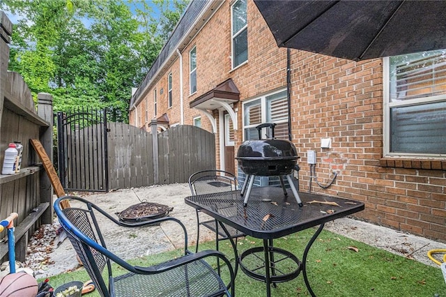 115 Winding River Dr Unit B, Atlanta, GA 30350 - view of patio featuring a gate and area for grilling