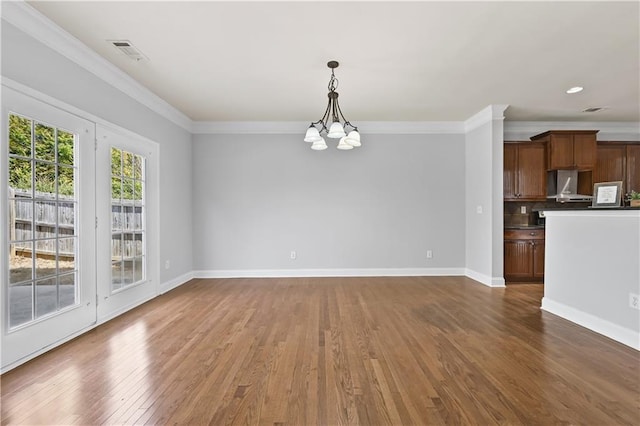 120 Daniel Creek Ln, Sugar Hill, GA 30518 - unfurnished living room with a chandelier, wood finished floors, and ornamental molding