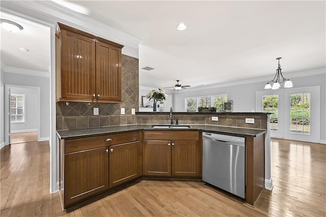 120 Daniel Creek Ln, Sugar Hill, GA 30518 - kitchen featuring dishwasher, tasteful backsplash, light wood finished floors, a ceiling fan, and crown molding