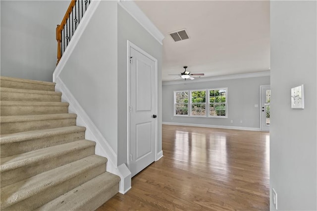 120 Daniel Creek Ln, Sugar Hill, GA 30518 - stairway with crown molding, wood finished floors, and a ceiling fan