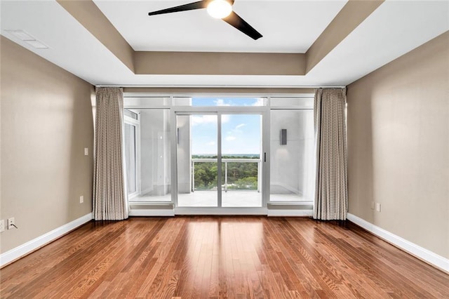 2881 Peachtree Rd NE Unit 1202, Atlanta, GA 30305 - empty room featuring wood finished floors, ceiling fan, and baseboards