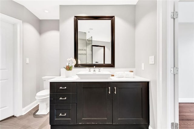2881 Peachtree Rd NE Unit 1202, Atlanta, GA 30305 - bathroom featuring vanity, toilet, and baseboards