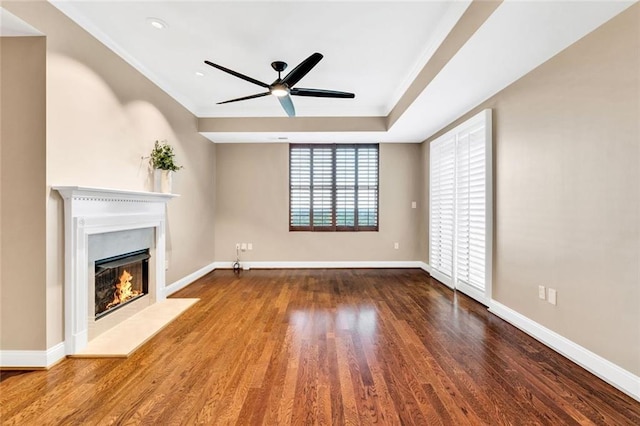2881 Peachtree Rd NE Unit 1202, Atlanta, GA 30305 - unfurnished living room with a lit fireplace, a ceiling fan, crown molding, wood finished floors, and baseboards