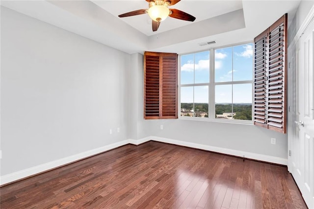2881 Peachtree Rd NE Unit 1202, Atlanta, GA 30305 - unfurnished room with a ceiling fan, baseboards, hardwood / wood-style floors, and a raised ceiling