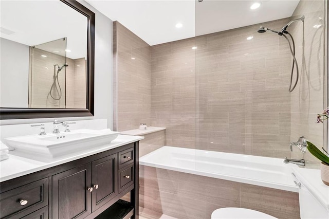 2881 Peachtree Rd NE Unit 1202, Atlanta, GA 30305 - bathroom with tiled shower / bath, vanity, recessed lighting, and toilet