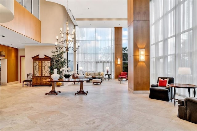 2881 Peachtree Rd NE Unit 1202, Atlanta, GA 30305 - common area featuring a towering ceiling and floor to ceiling windows