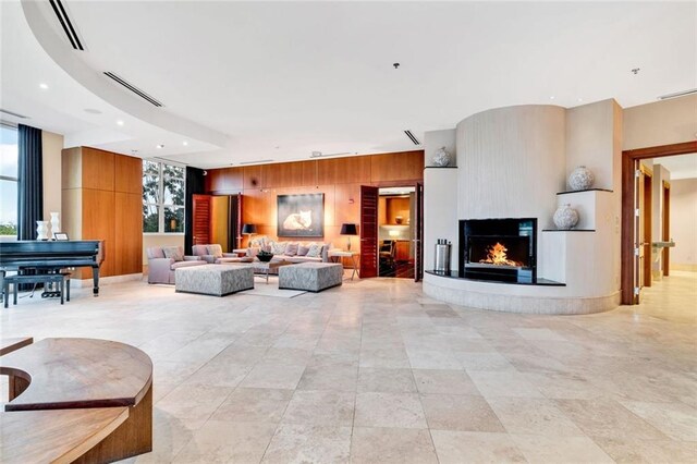 2881 Peachtree Rd NE Unit 1202, Atlanta, GA 30305 - living area featuring a fireplace, wood walls, and recessed lighting