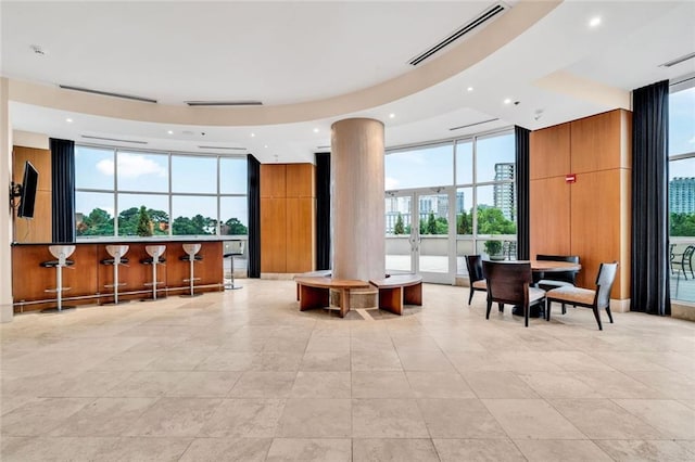 2881 Peachtree Rd NE Unit 1202, Atlanta, GA 30305 - community lobby featuring a wall of windows, recessed lighting, and a towering ceiling