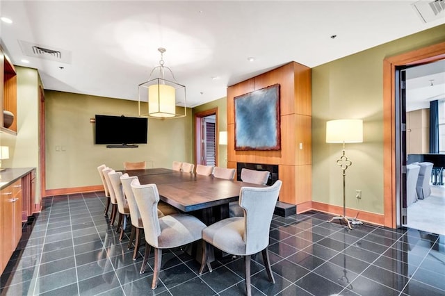 2881 Peachtree Rd NE Unit 1202, Atlanta, GA 30305 - dining room featuring baseboards, recessed lighting, and dark tile patterned floors