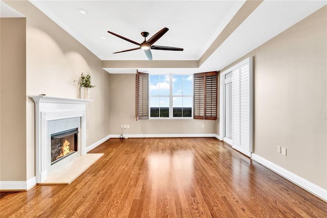 2881 Peachtree Rd NE Unit 1202, Atlanta, GA 30305 - unfurnished living room with ceiling fan, a lit fireplace, wood finished floors, baseboards, and recessed lighting