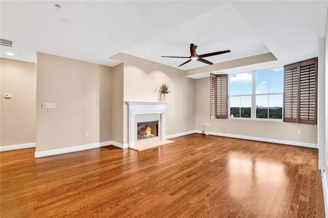 2881 Peachtree Rd NE Unit 1202, Atlanta, GA 30305 - unfurnished living room with a ceiling fan, wood finished floors, baseboards, a glass covered fireplace, and recessed lighting