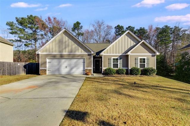 view of front of house featuring a garage and a front lawn