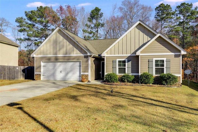 view of front of property featuring a garage and a front lawn