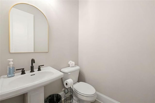 bathroom featuring sink and toilet