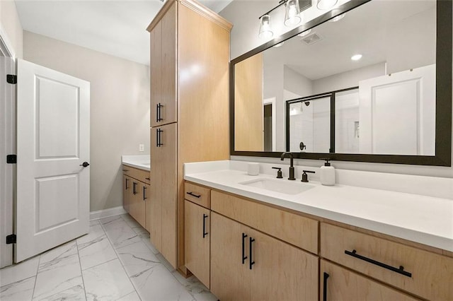 bathroom with vanity and an enclosed shower