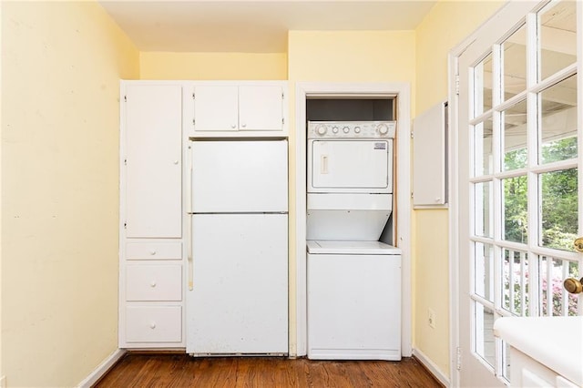 70 Mount Paran Rd NE, Atlanta, GA 30342 - washroom with stacked washer and clothes dryer, dark wood-type flooring, and baseboards