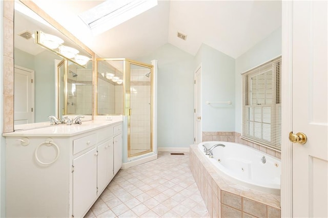 70 Mount Paran Rd NE, Atlanta, GA 30342 - bathroom with a skylight, a stall shower, a tub with jets, lofted ceiling, and vanity