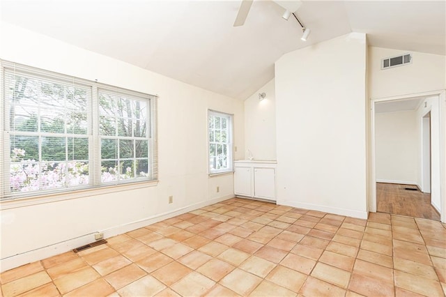 70 Mount Paran Rd NE, Atlanta, GA 30342 - empty room featuring vaulted ceiling, track lighting, ceiling fan, baseboards, and light tile patterned floors