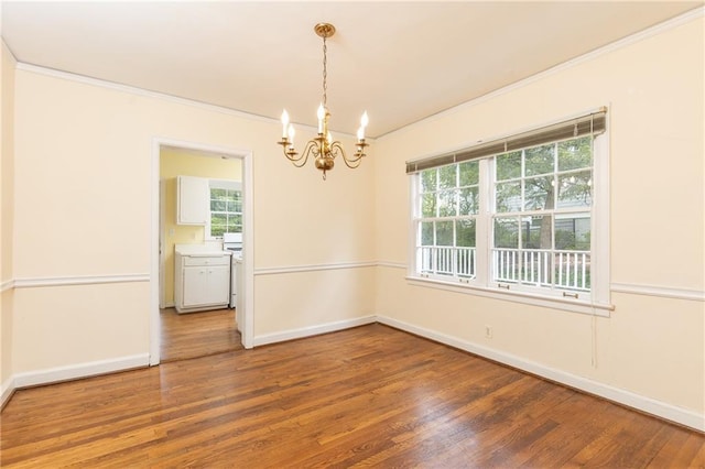 70 Mount Paran Rd NE, Atlanta, GA 30342 - unfurnished room with ornamental molding, a chandelier, healthy amount of natural light, wood finished floors, and baseboards