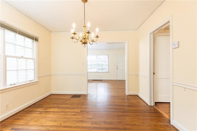 70 Mount Paran Rd NE, Atlanta, GA 30342 - unfurnished dining area featuring a chandelier, wood finished floors, baseboards, and crown molding