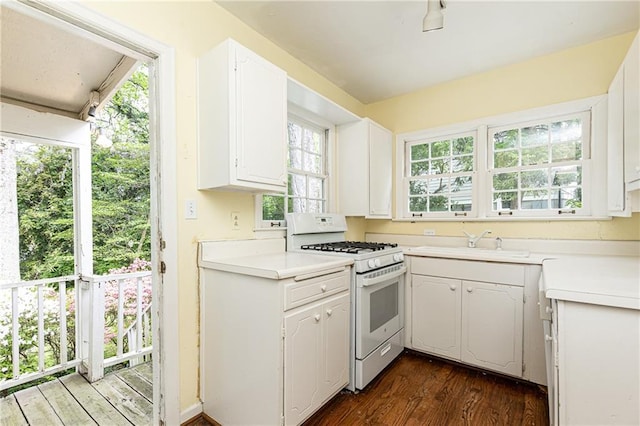 70 Mount Paran Rd NE, Atlanta, GA 30342 - kitchen featuring white range with gas cooktop, a sink, dark wood-style flooring, and light countertops