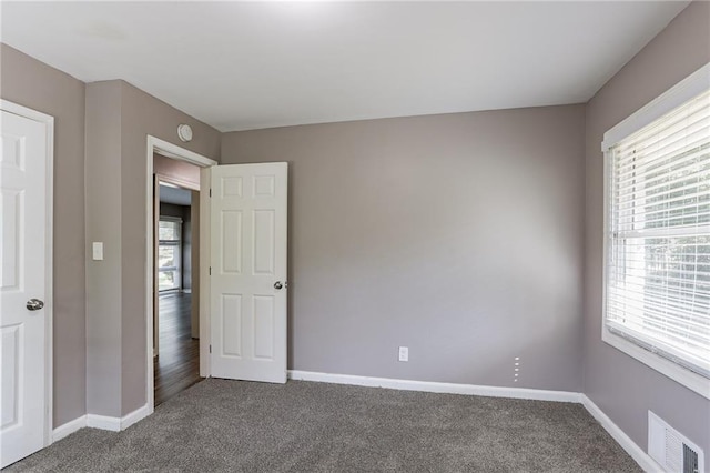 unfurnished bedroom featuring carpet floors