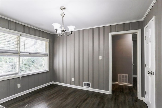 unfurnished room featuring crown molding, a chandelier, and dark hardwood / wood-style flooring